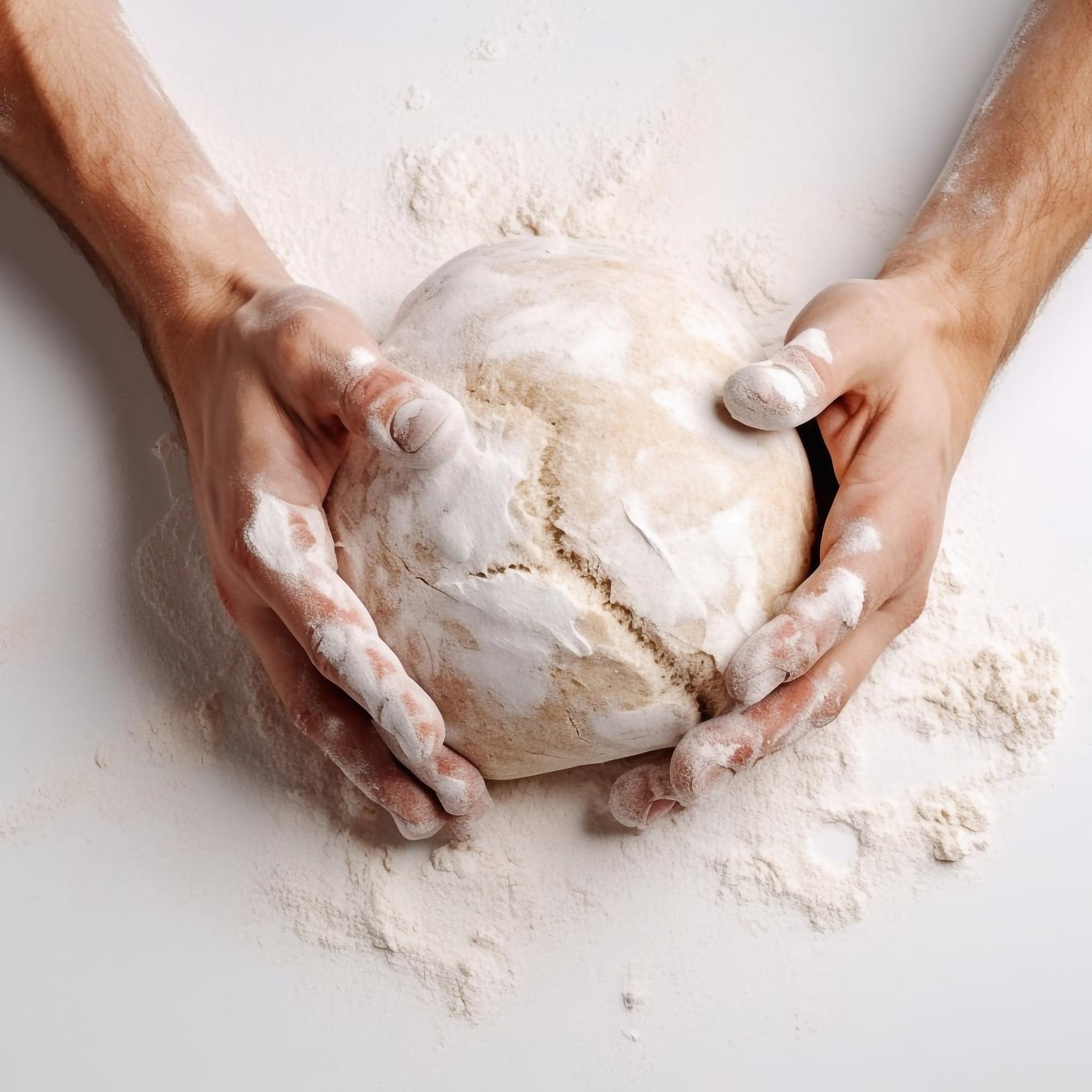 Hands kneading dough during class